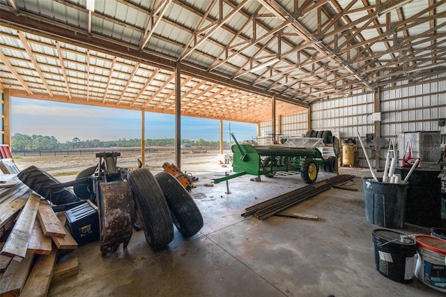 garage featuring metal wall and a rural view