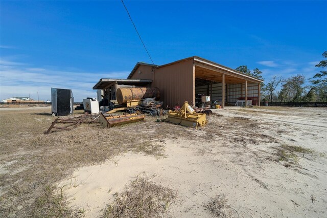 view of home's exterior with a pole building