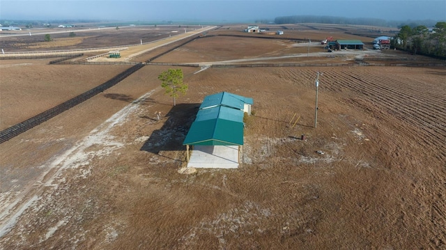 birds eye view of property featuring a rural view