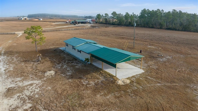 birds eye view of property featuring a rural view