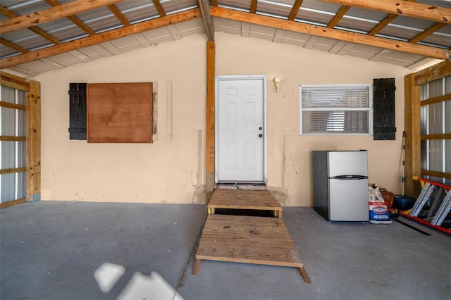 garage with freestanding refrigerator