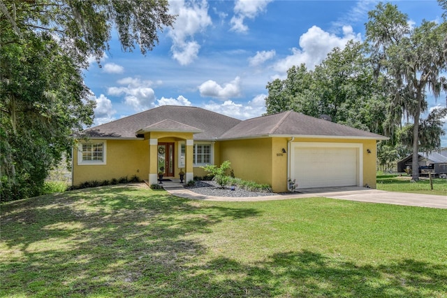 ranch-style home featuring a garage and a front lawn