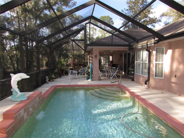 view of pool featuring a patio and a lanai