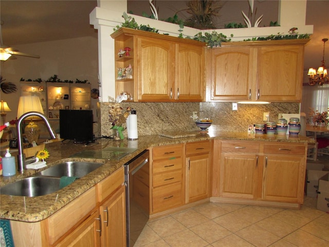 kitchen with dishwasher, sink, light tile patterned floors, and backsplash