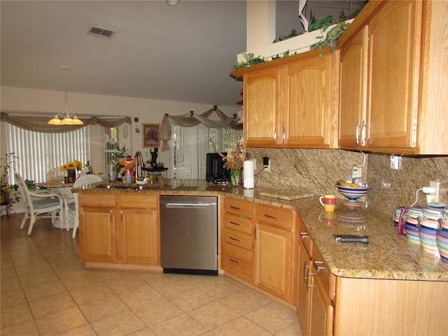 kitchen featuring light tile patterned flooring, dishwasher, hanging light fixtures, and backsplash