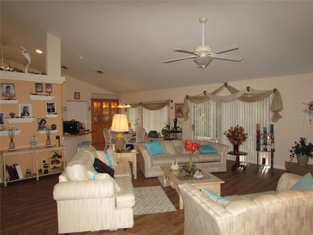 living room featuring vaulted ceiling, dark hardwood / wood-style floors, and ceiling fan