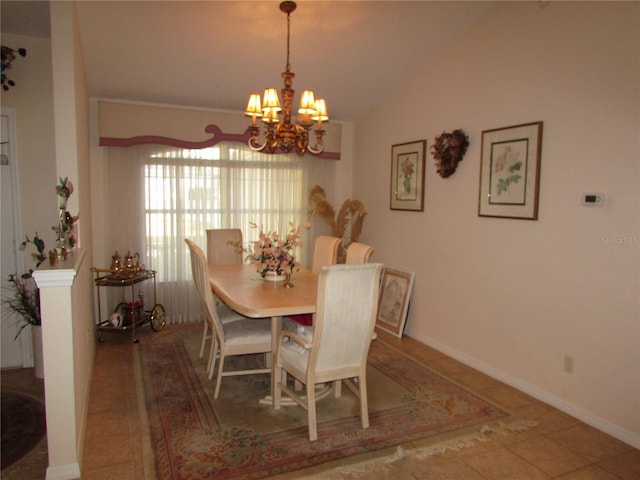 tiled dining space with lofted ceiling and a notable chandelier