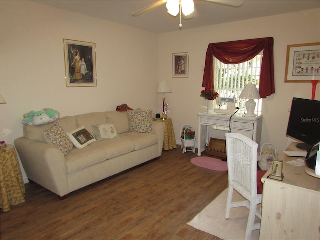 living room featuring ceiling fan and dark hardwood / wood-style floors