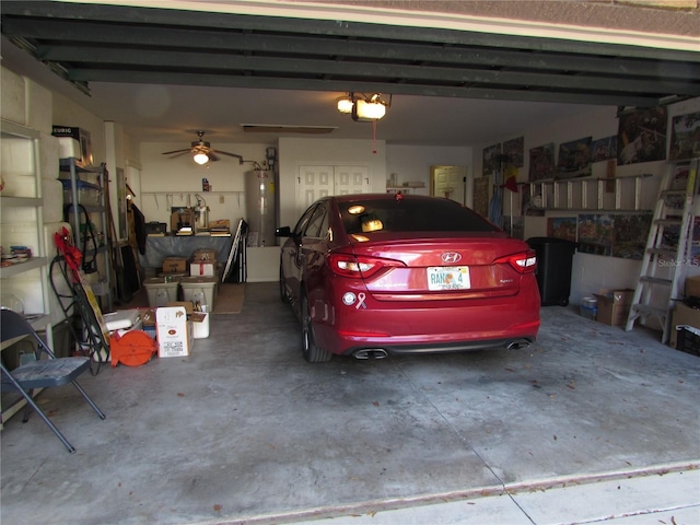 garage featuring a garage door opener and water heater