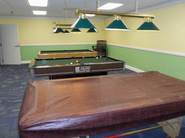 recreation room featuring billiards, ornamental molding, and dark colored carpet