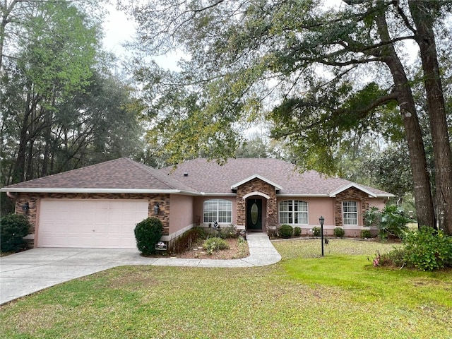 single story home featuring a front yard and a garage