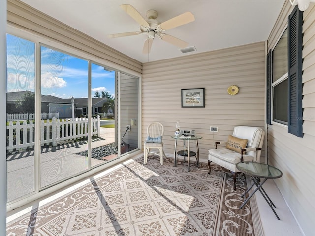 sunroom / solarium with ceiling fan