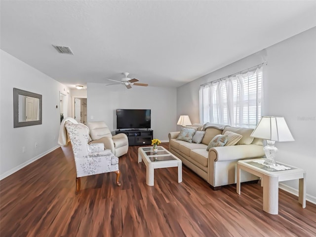 living room with ceiling fan and dark hardwood / wood-style flooring