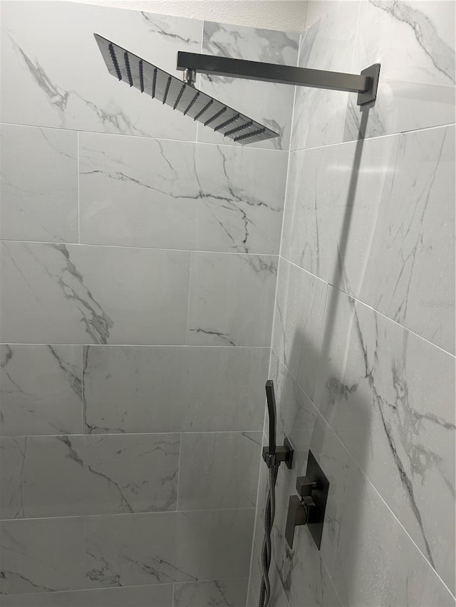 room details with a tile shower