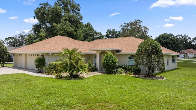 view of front facade featuring a garage and a front lawn