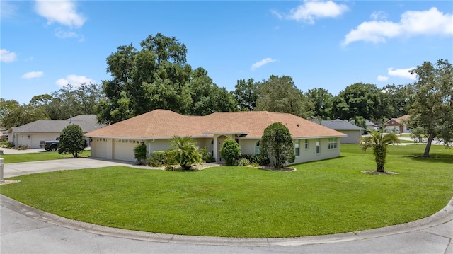 single story home featuring a garage and a front yard