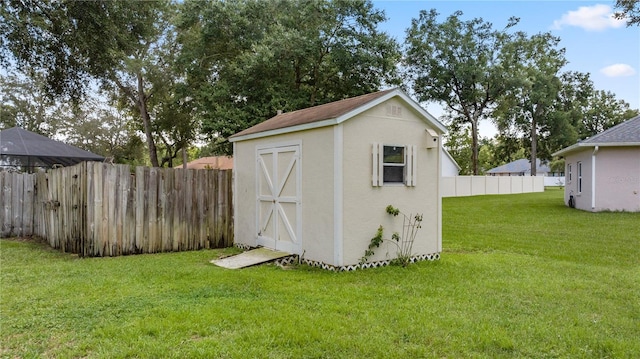 view of outdoor structure featuring a yard