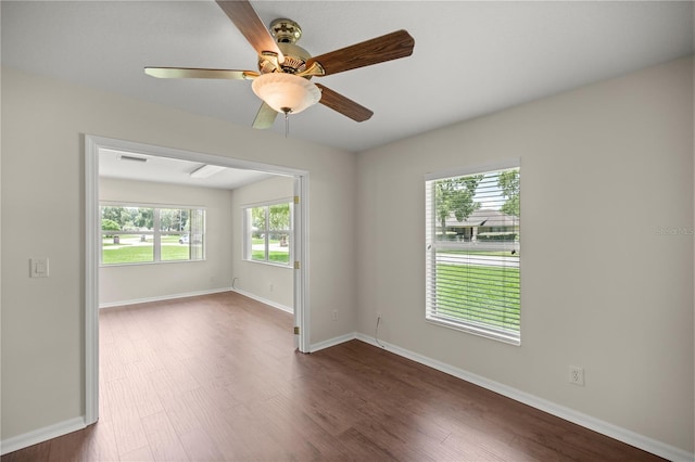 empty room featuring dark hardwood / wood-style floors and ceiling fan