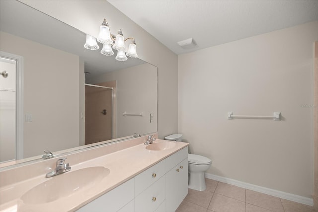 bathroom with tile patterned flooring, vanity, toilet, a chandelier, and walk in shower