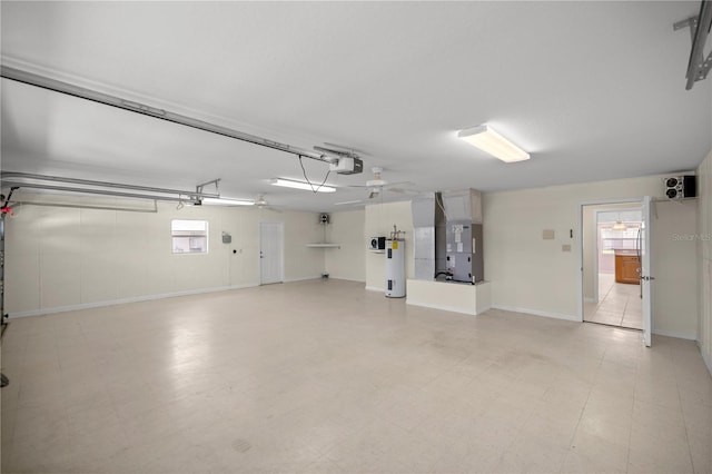 garage with heating unit, a garage door opener, electric water heater, and ceiling fan