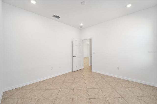 empty room with light tile patterned floors