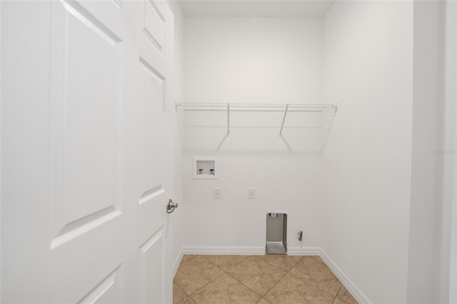 washroom with light tile patterned flooring, hookup for an electric dryer, and hookup for a washing machine