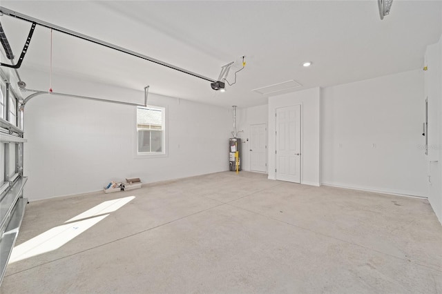 garage featuring a garage door opener and electric water heater