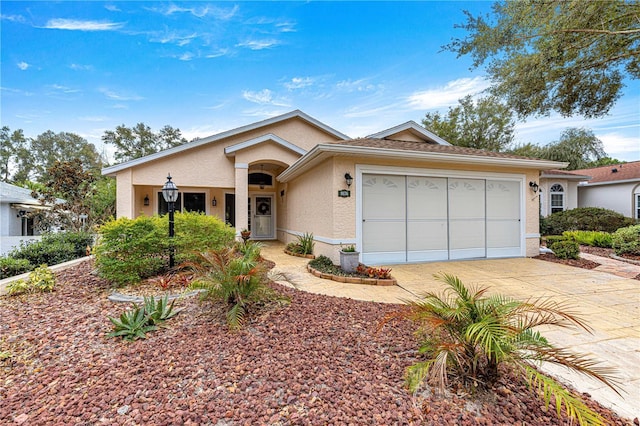 single story home featuring a garage