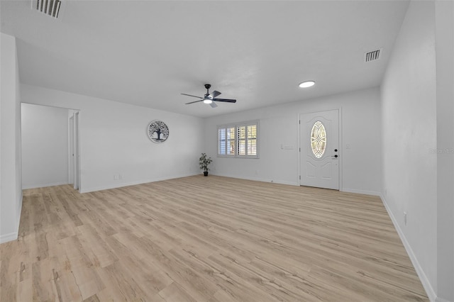 foyer entrance with light hardwood / wood-style floors and ceiling fan