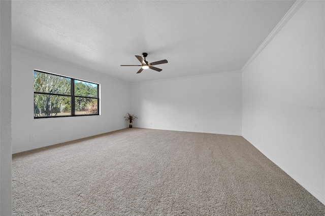 carpeted spare room with ceiling fan, ornamental molding, and a textured ceiling