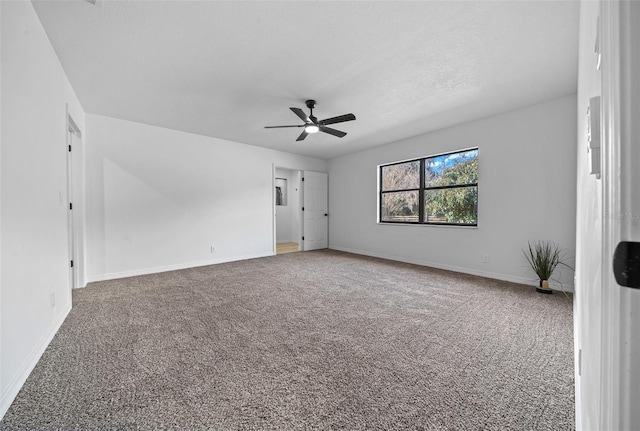 carpeted empty room with a textured ceiling and ceiling fan