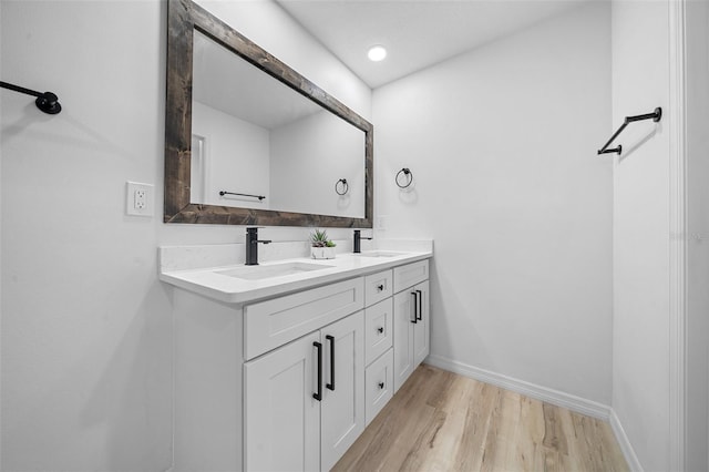 bathroom featuring vanity and hardwood / wood-style floors