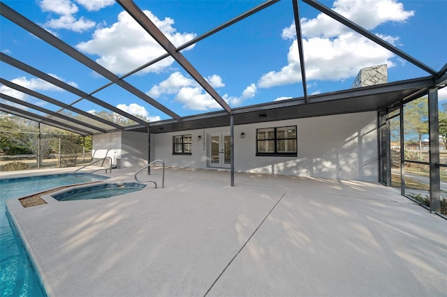 view of pool with french doors, an in ground hot tub, and a patio area