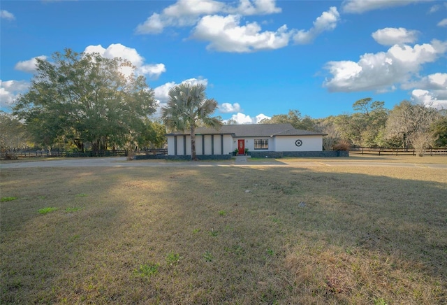 view of front of home featuring a garage and a front lawn