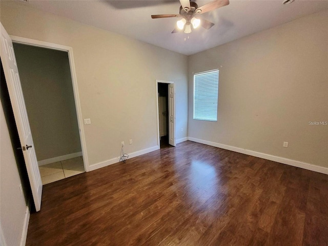 unfurnished bedroom with dark wood-type flooring and ceiling fan