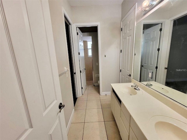 bathroom with tile patterned flooring and vanity