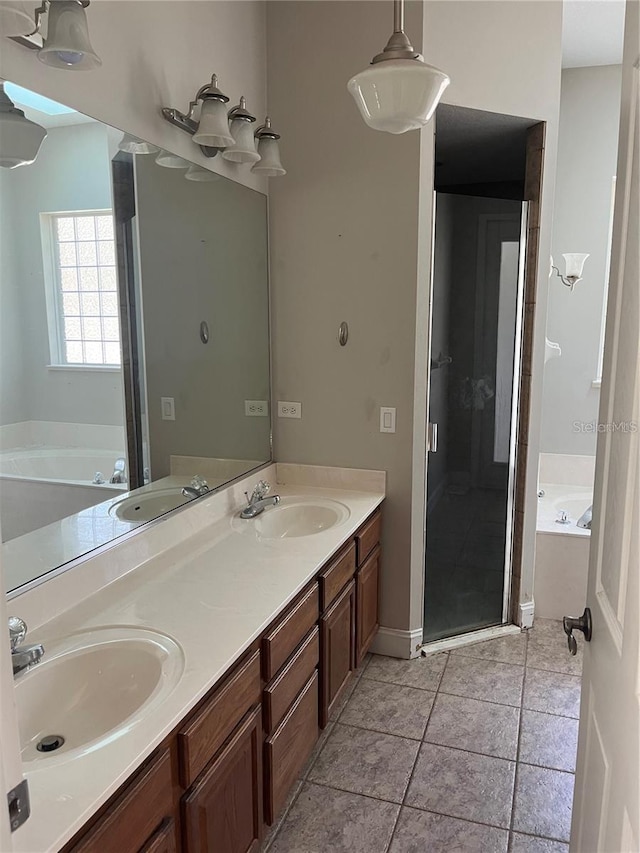 bathroom with vanity, tile patterned flooring, and shower with separate bathtub