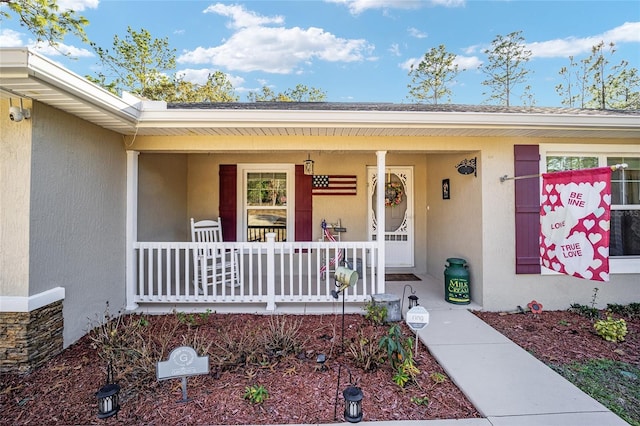 doorway to property with covered porch