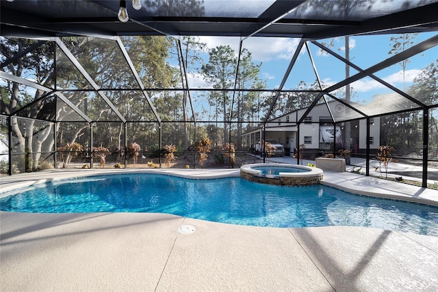 view of pool featuring a lanai, a patio, and an in ground hot tub