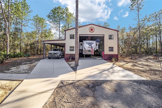 exterior space with a garage and a carport