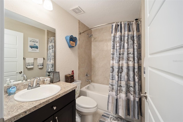 full bathroom featuring toilet, vanity, a textured ceiling, and shower / bath combo with shower curtain