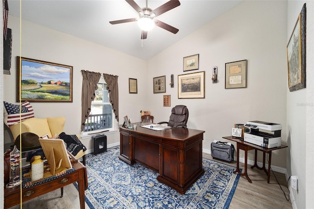 office with ceiling fan, lofted ceiling, and light hardwood / wood-style floors