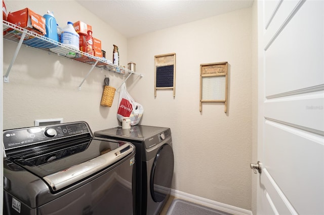 washroom featuring independent washer and dryer