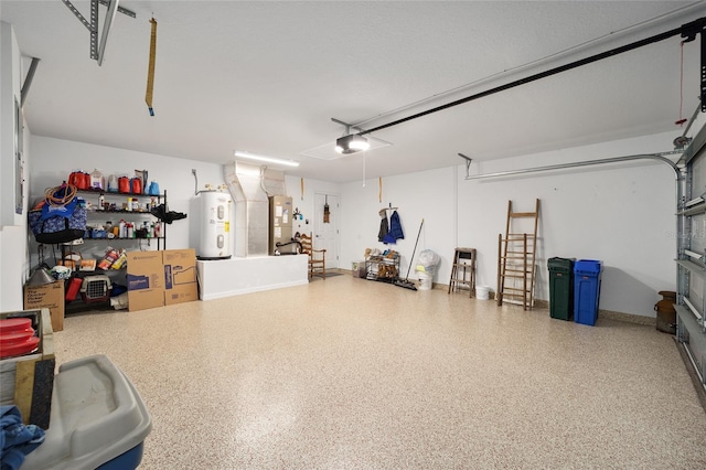 garage with a garage door opener and water heater