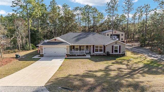 view of front facade featuring a garage, a front lawn, and a porch