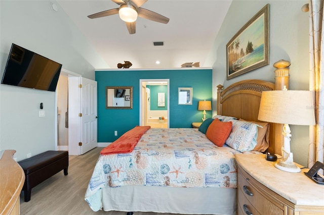 bedroom featuring ceiling fan, ensuite bathroom, and light hardwood / wood-style flooring