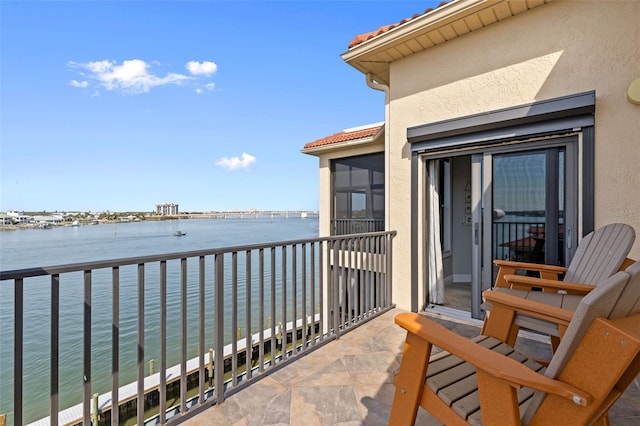 balcony featuring a water view