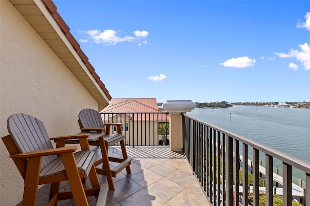 balcony featuring a water view