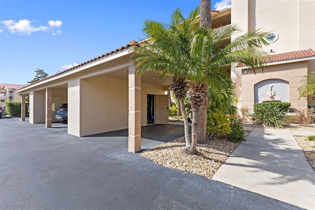 exterior space featuring a carport