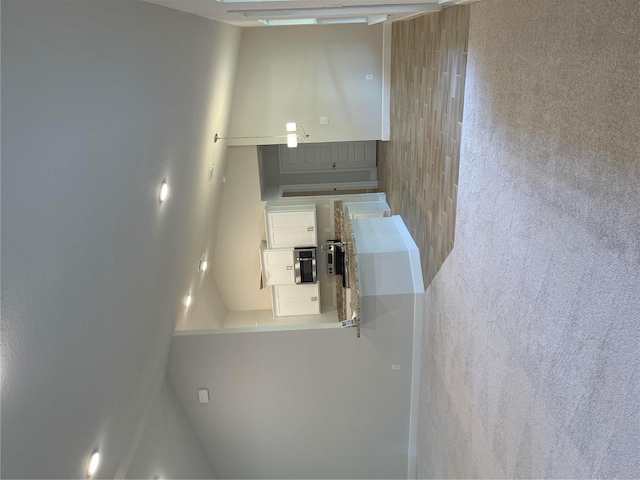 kitchen featuring white cabinets